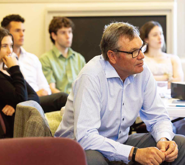 Engaged participants looking to front of room.